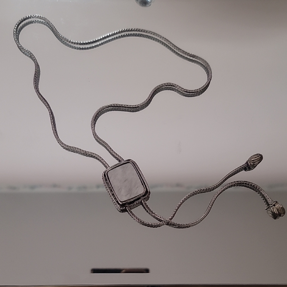 NWOT Silver Bolo Tie With Mother Of Perl Accent.